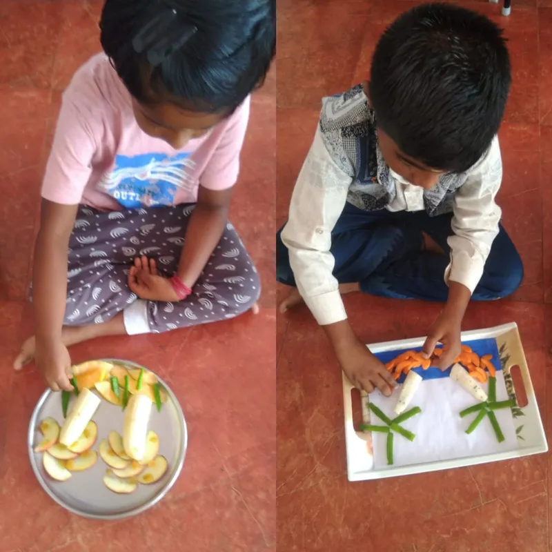 Grade 1 Nature's Palette 2_result An array of carved fruits and vegetables including banana, cucumber, and pomegranate, artfully created by first graders in a leading Salem CBSE school's nature palette activity.