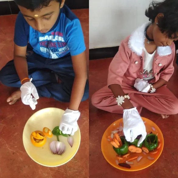 Vibrant display of fruit and vegetable carvings by first graders, featuring a duck made from lemon and carrot, highlighting hands-on learning at a top CBSE school in Salem.