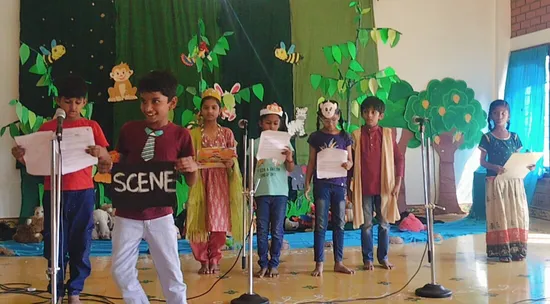 Dedicated teacher at Vidhya Peetham i-School, one of the top CBSE schools in Salem, guiding young students during their skit rehearsals.