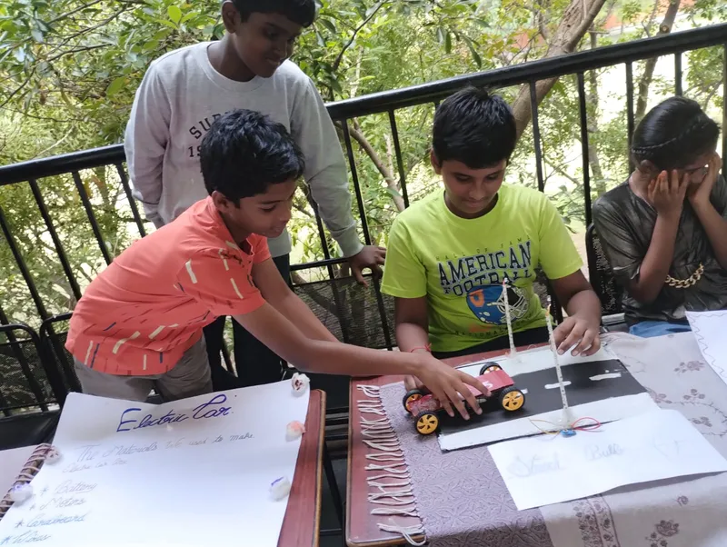 Young scientists from one of Salem's best CBSE schools presenting their electric circuit projects, linking classroom learning to real-world applications.