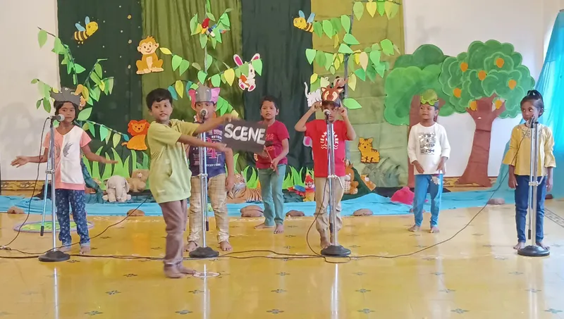 Young performers in animal and bird headbands actively participating in the Jataka Tales skit, highlighting the vibrant extracurricular activities at one of the top schools in Salem.