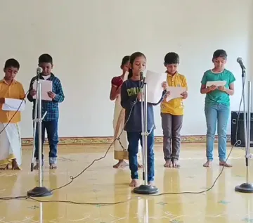 3b Closet Drama 2_result A group of young actors from Grade 3b practicing their lines into microphones, dressed in vibrant character costumes, at the best CBSE school in Salem.