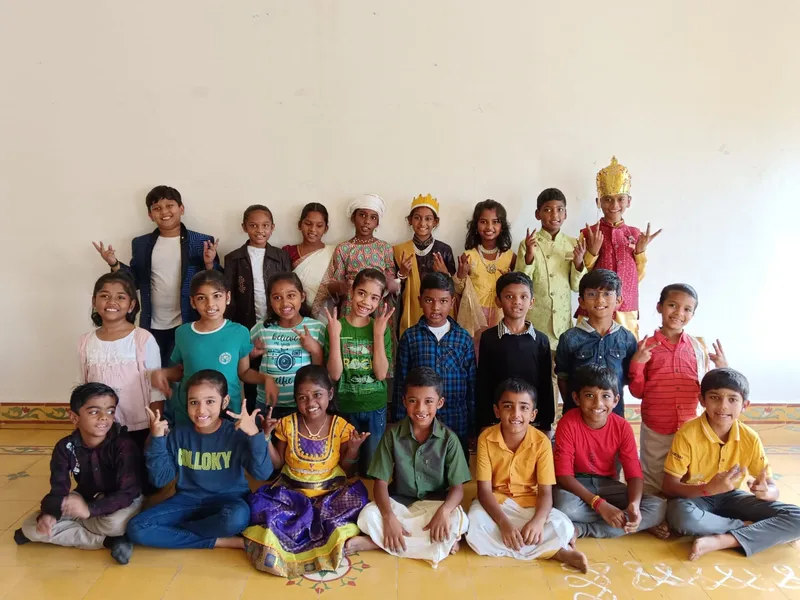 3b Closet Drama 3_result Happy and excited third graders posing in colorful attire, giving peace signs, after their successful Closet Drama performances at one of the top schools in Salem.