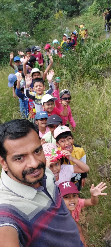 Happy faces of Grade 2 children during a nature trail, guided by Dr. Magesh, a naturalist and animal rescuer.
