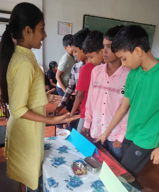 Curious students examining samples of metallic minerals during a Social Studies session on Agriculture and Minerals at a leading school in Salem.