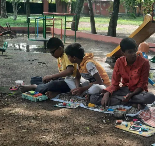 Young learners from one of the best CBSE schools in Salem creating playdough models of the Earth's layers.