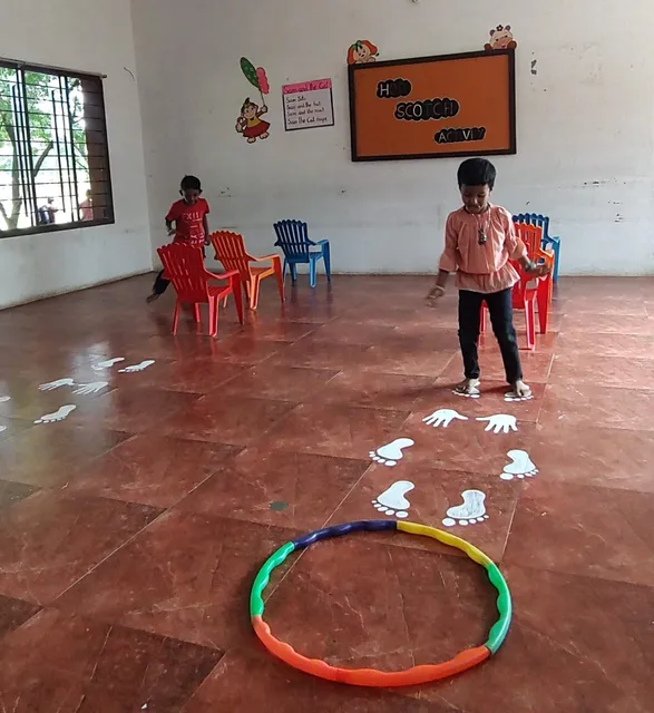 Vidhya Peetham i-School's UKG class competes in a hopscotch challenge, showcasing the school's commitment to active learning.