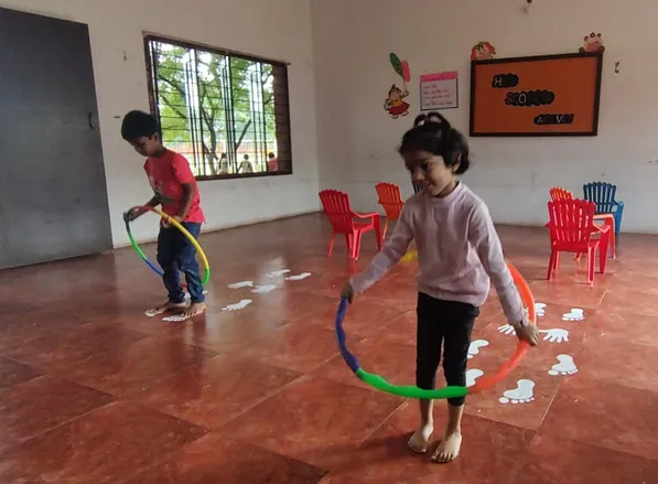 UKG Hopscotch activity 4_result Boys and girls at a leading CBSE school in Salem participate in a hopscotch activity, promoting teamwork and cognitive development.