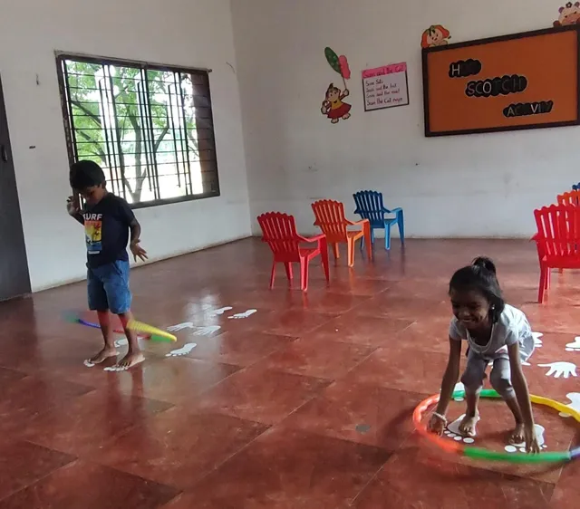 UKG students at Vidhya Peetham i-School in Salem playing hopscotch, enhancing balance and coordination.