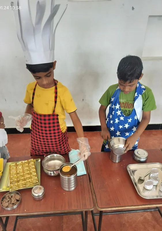 udding chefs focusing on mixing ingredients for their Crispy Chocolate Cake at a school activity in Salem.