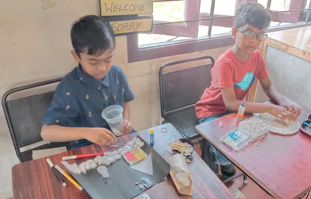Happy students engaged in cotton bud art activities, crafting unique designs at a top CBSE school in Salem.
