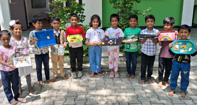 Children in Grade 1 displaying their clay models during the clay modelling activity.
