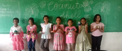 Students painting coconut shells with intricate designs at a top CBSE school in Salem.