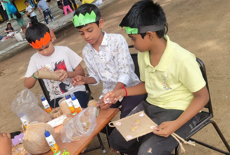 Grade 5 students crafting with jute during the Jute Craft Activity.