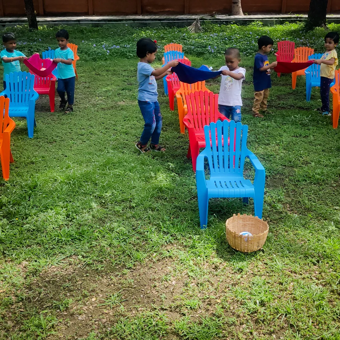 Young students of Vidhya Peetham i-School working together in a gross motor skills activity.