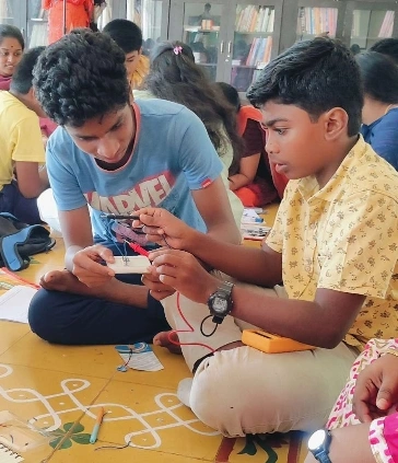 Engrossed duo during the electronics and circuits workshop