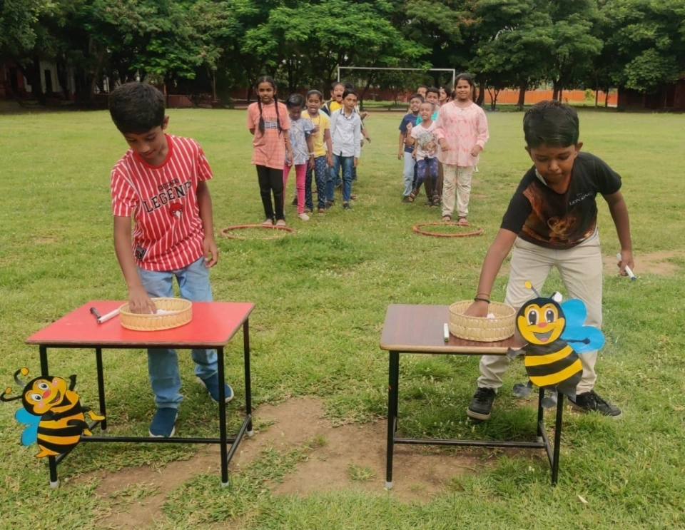 Children participating in interactive Tamil vocabulary building activity