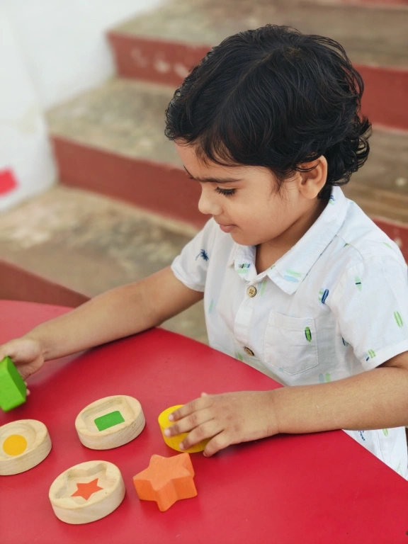 Student practicing shape identification with educational materials