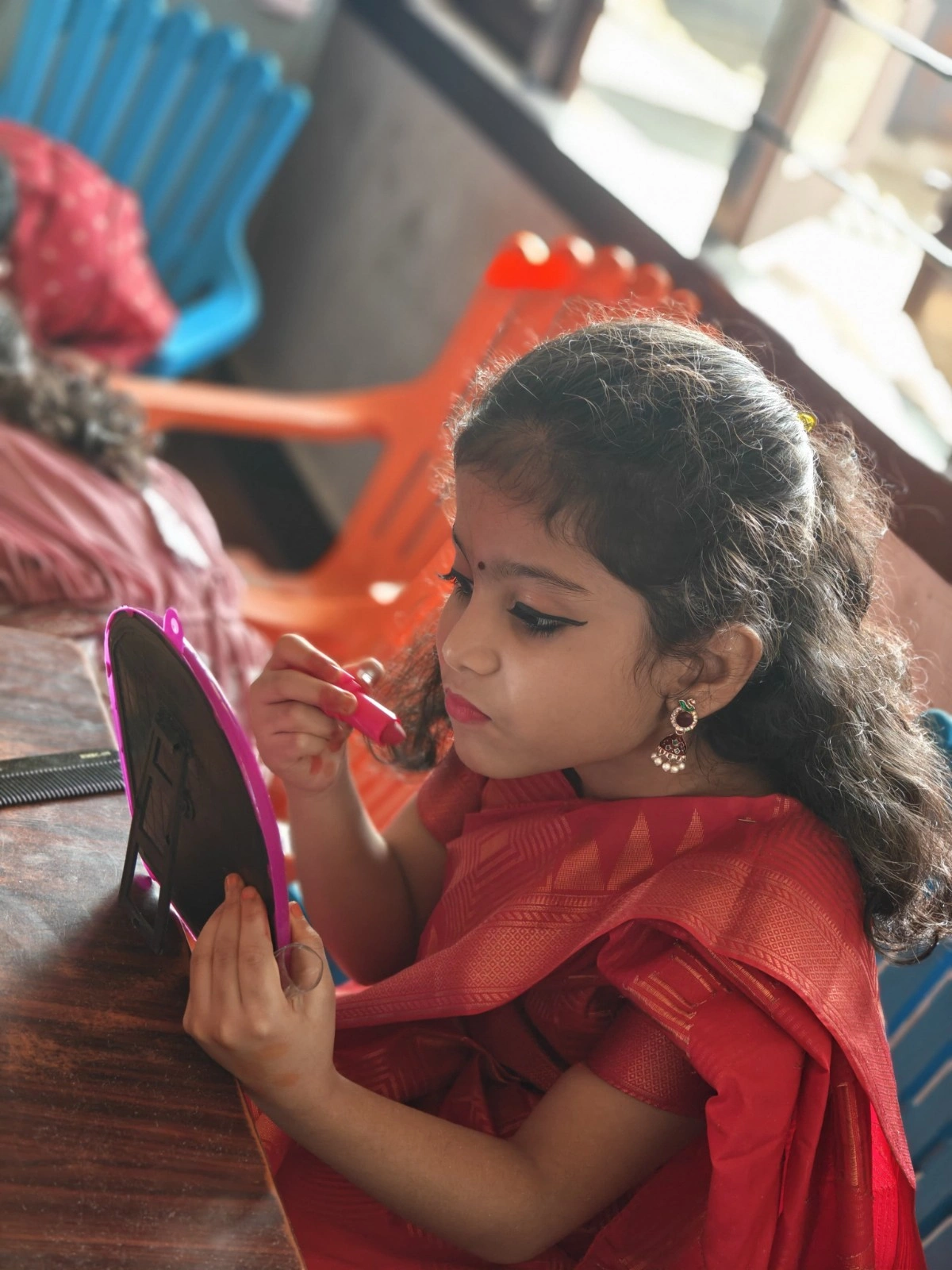 Student creatively using props during cultural costume activity