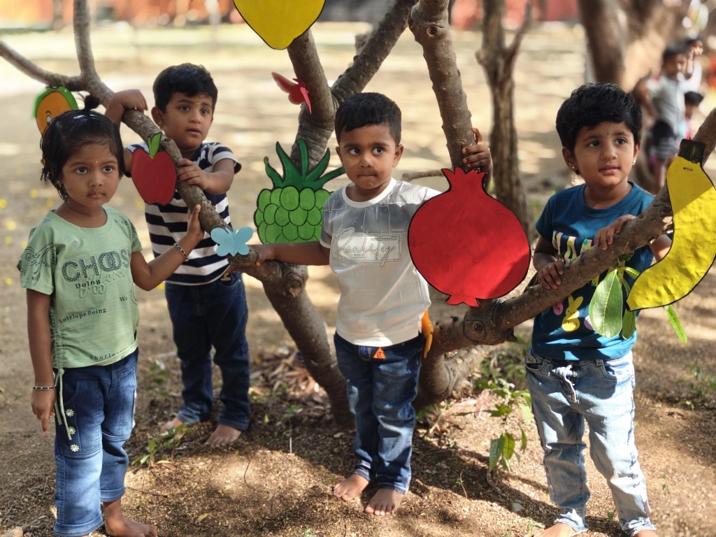 Students actively participating in the outdoor fruit identification learning session