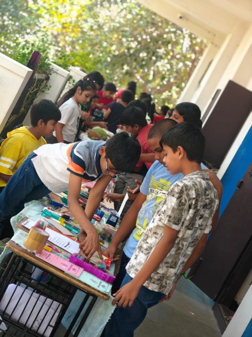 Wide view of student-run stalls at the VPIS math market activity
